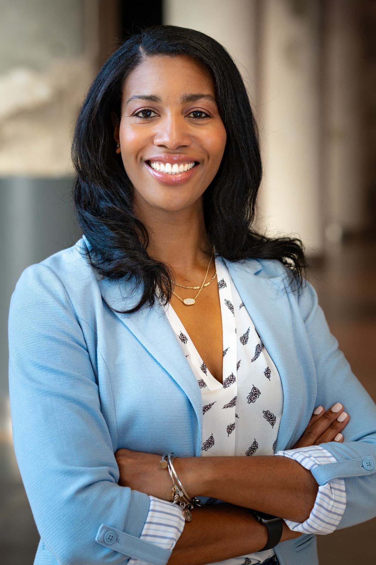 Jacqueline Butts, Chief Executive Officer and President of MEM10 Consulting, smiling in a light blue blazer
